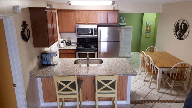 Kitchen and Bar with Granite Counter-Tops